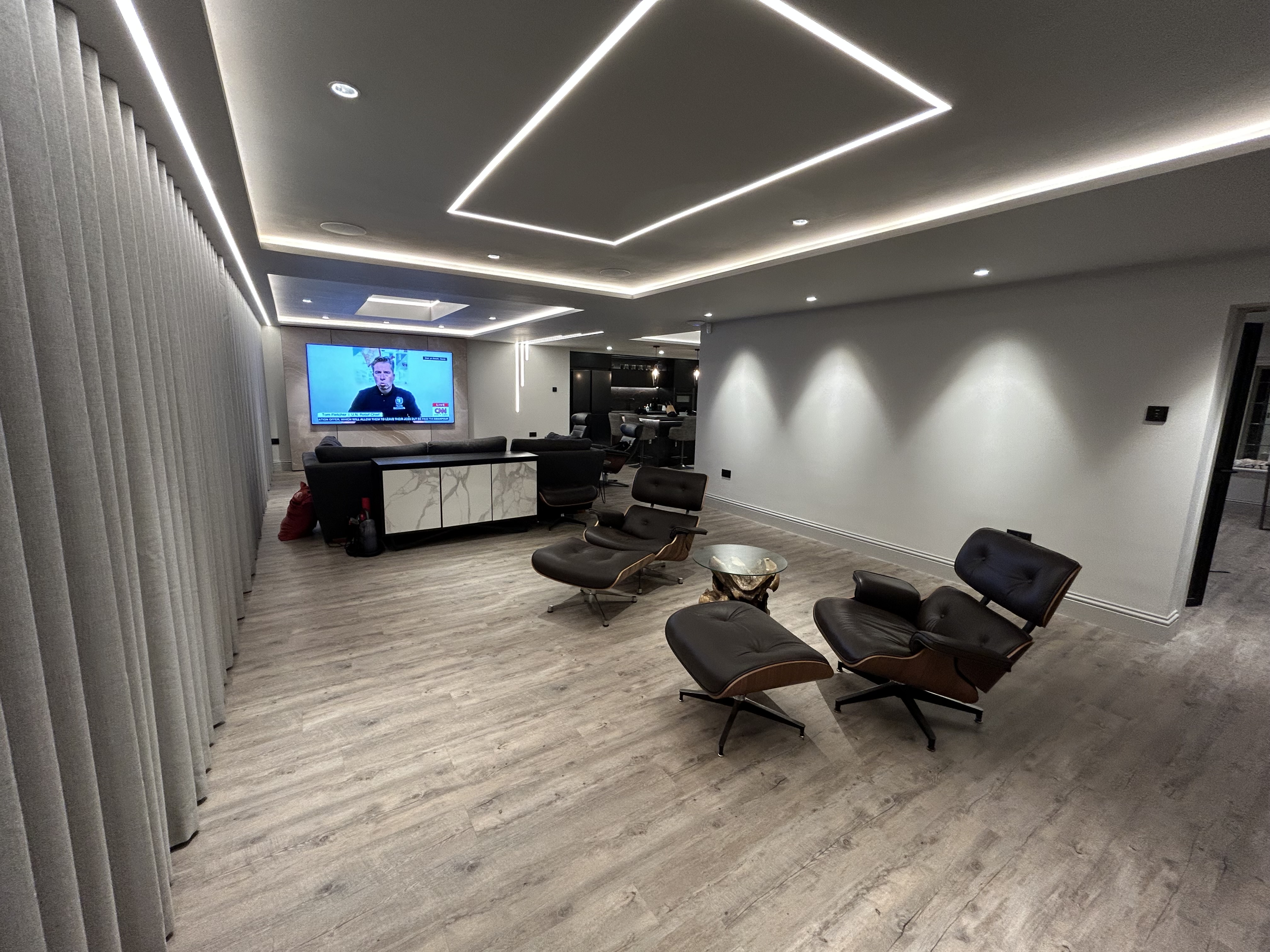 Living room with geometric ceiling lighting